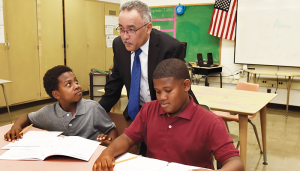 Jaime Alicea, the newly appointed interim superintendent at Syracuse City School District, interacting with students.