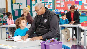 Janet Fureno, from left, Steve Walker and Evelyn Crockett Dykes volunteer in the Foster Grandparent Program with PEACE, Inc., in Syracuse.