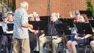 Members of the Lyncourt Community Band performing last year in front of the East Syracuse Free Library in East Syracuse. A diverse membership performs throughout the summer.