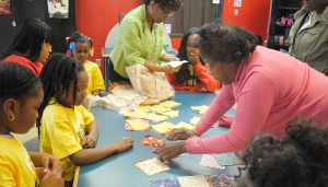 Dorothy (“Dottie”) White teaching kids at Southwest Community Center in Syracuse the basics of quilting.