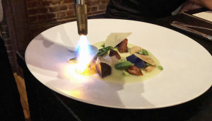 Spring Pea Torch: The spring pea and parmesan plate gets special treatment before being served.