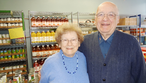 Sue and Ernie Wass at Temple Concord’s food pantry. In their 16 years with the organization, the North Syracuse couple has been able to grow the pantry to a larger, more comprehensive operation.