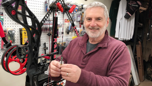 Mike Fitzgerald at his archery shop, Fitz’s Archery, in Central Square. He said the sport has become more popular after the movie ‘Hunger Games.’