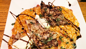 Chicken/Risotto: Grilled chicken and mozzarella sit atop a bed of creamy, tomato-based risotto.