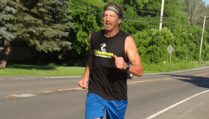 Mike Samoraj running on the streets of Baldwinsville as he prepares for the Lake Placide Ironman.