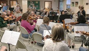 Members of the Salt City New Horizons Orchestra at a recent rehearsal in the United Methodist Church in Fayetteville. During the summer, there are roughly 25 to 30 participants. In the fall, the group typically grows to about 60.