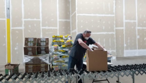 Joe Wrobel of Liverpool, one of 800 volunteers who have kept the Food Bank of Central New York active during the pandemic. “If you volunteer and do something for the community, helping others, you just get a great feeling,” he says.