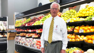 Mike Hennigan, owner of Nichols Supermarket in the heart of Liverpool. “I’ve worked pretty much every job in the store,’’ Hennigan says. “I used to be able to operate every piece of equipment.’’ Photo by Margaret McCormick