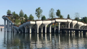 Little Island is the newest attraction in New York City. Opened in May, it features rolling hills, walking paths and open lawns, with dazzling views of NYC and a beautifully curated mix of trees, shrubs, perennials and grasses.