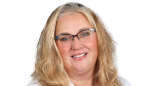 Nurse Rita Wicks is busy overseeing several health programs at Oswego Health. She also volunteers for the Brewerton Fire Department as its first female firefighter lieutenant.